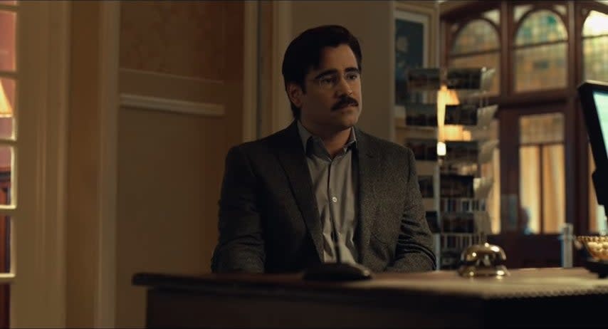 David sitting at a desk in "The Lobster"