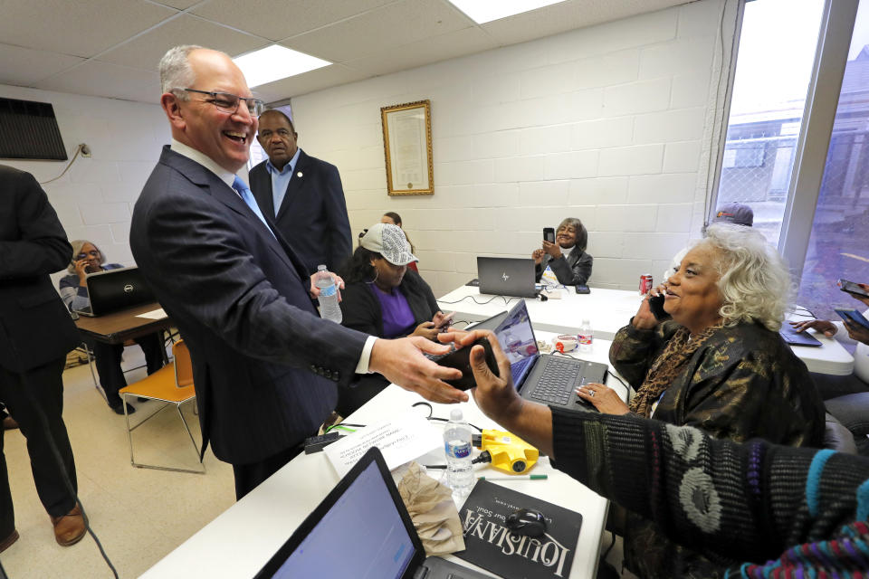 Louisiana Gov. John Bel Edwards greets campaign workers in Shreveport, La., Thursday, Nov. 14, 2019. Edwards, a Democrat, was campaigning in the same metropolitan area his Republican challenger, Eddie Rispone, will be holding a campaign rally with President Donald Trump later in the evening. (AP Photo/Gerald Herbert)