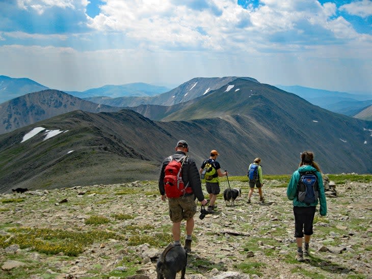 Hikers walking down ridge of Mount Edwards