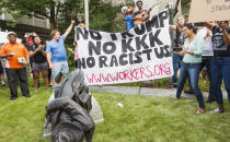 <p>Protesters celebrate after toppling a statue of a Confederate soldier in Durham, N.C. Monday, Aug. 14, 2017. Activists on Monday evening used a rope to pull down the monument outside a Durham courthouse. The Durham protest was in response to a white nationalist rally held in Charlottesville, Va., over the weekend. (Photo: Casey Toth/The Herald-Sun via AP) </p>