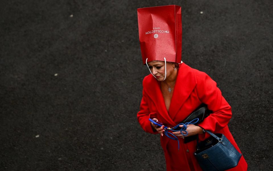 Trying to hide from the rain at Cheltenham - SPORTSFILE VIA GETTY IMAGES