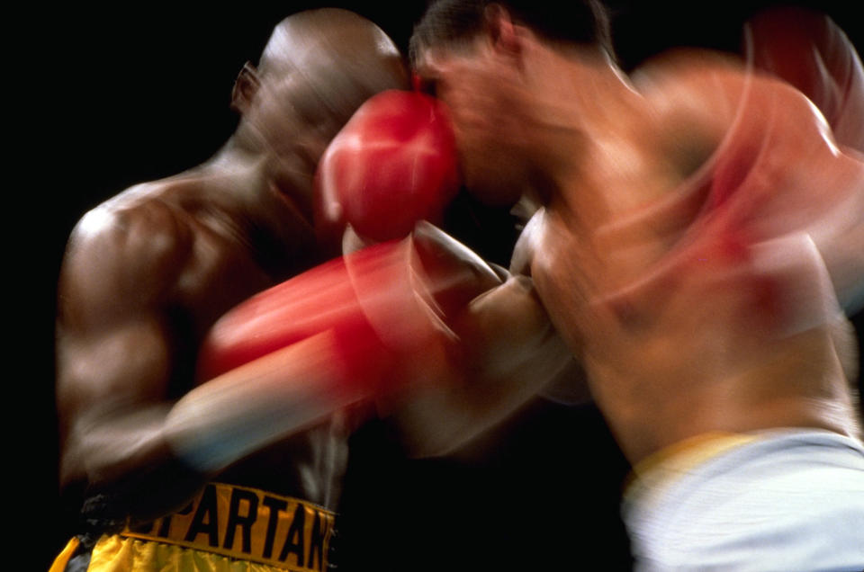 Two boxers are engaged in a match