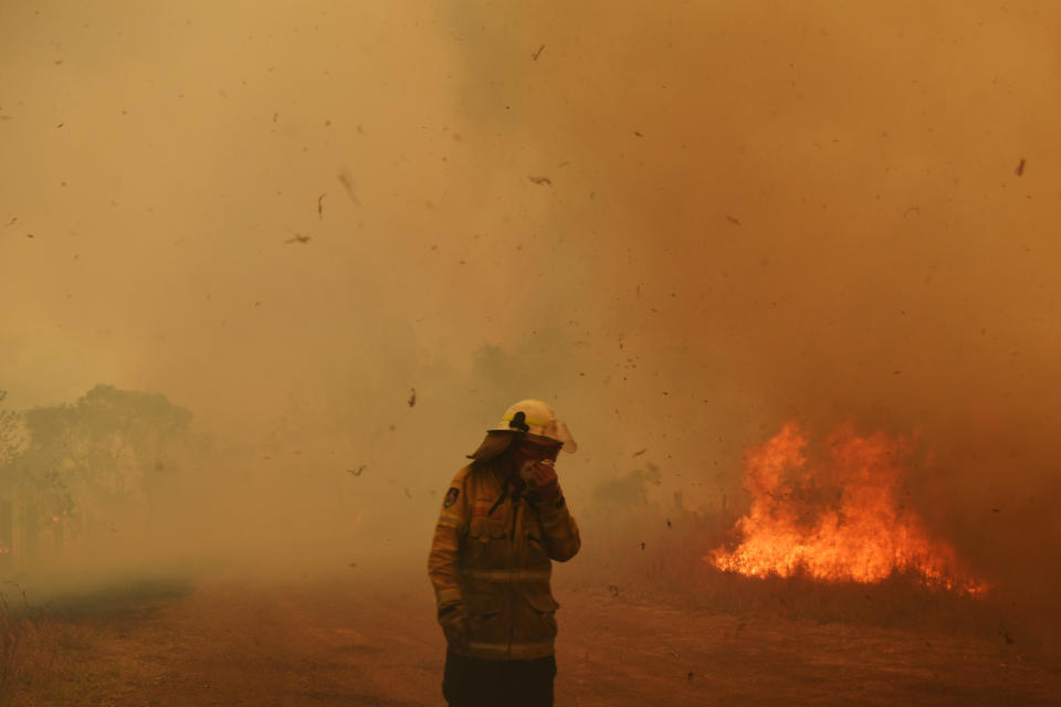 Firefighters battle a spot fire in Hillville, Australia. 