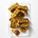 <p>You can never go wrong with crunchy, cheesy garlic bread. This one is made with focaccia and butter infused with Dijon mustard and lemon for extra flavor. </p><p>Get the <a href="https://www.goodhousekeeping.com/food-recipes/a41969423/cheesy-garlic-bread-recipe/" rel="nofollow noopener" target="_blank" data-ylk="slk:Cheesy Garlic Bread recipe;elm:context_link;itc:0;sec:content-canvas" class="link "><strong>Cheesy Garlic Bread recipe</strong></a>. </p><p><strong>RELATED: </strong><a href="https://www.goodhousekeeping.com/food-recipes/easy/g122/easy-appetizers/" rel="nofollow noopener" target="_blank" data-ylk="slk:50+ Easy Appetizers and Snacks to Get the Party Started;elm:context_link;itc:0;sec:content-canvas" class="link ">50+ Easy Appetizers and Snacks to Get the Party Started</a></p>