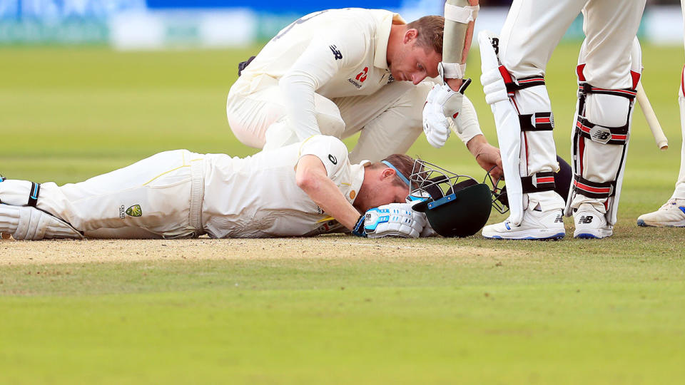 Jos Buttler, pictured here checking on Steve Smith. (Photo by Mike Egerton/PA Images via Getty Images)