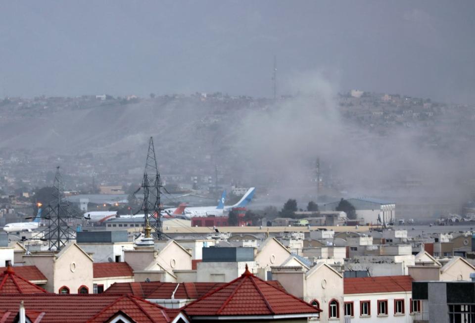 Smoke rises from explosion outside the airport in Kabul (Wali Sabawoon/AP) (AP)