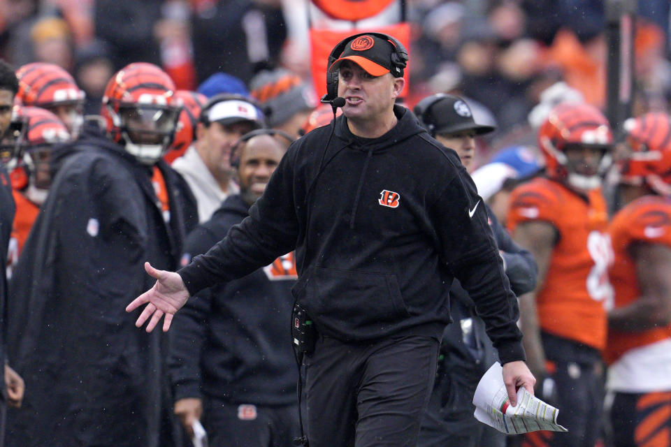 Cincinnati Bengals head coach Zac Taylor, center, walks the sidelines during the first half of an NFL football game against the Pittsburgh Steelers in Cincinnati, Sunday, Nov. 26, 2023. (AP Photo/Jeffrey Dean)