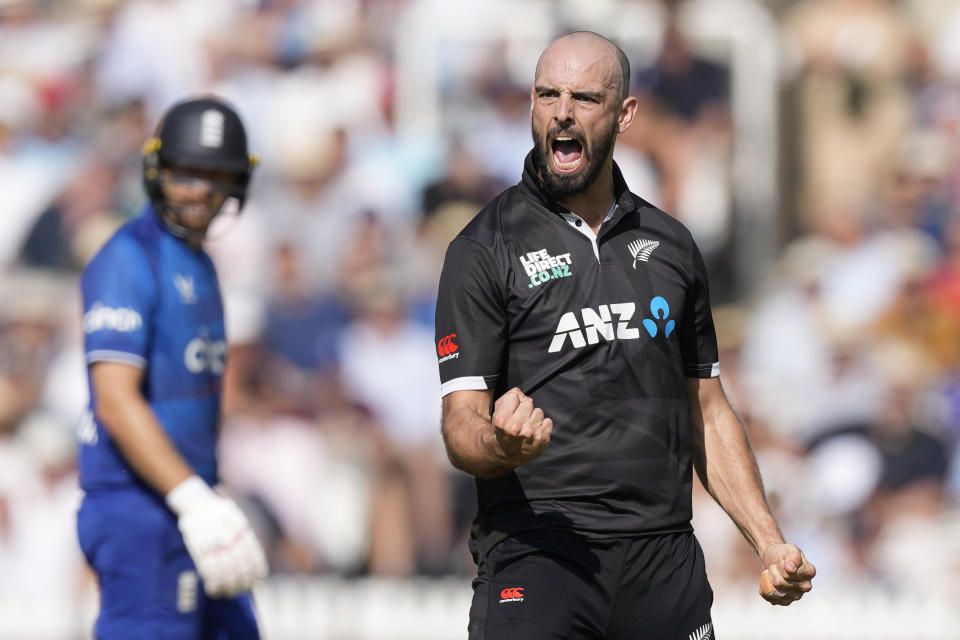 New Zealand's Daryl Mitchell celebrates dismissing England's Jos Buttler during the One Day International cricket match between England and New Zealand at Lord's cricket ground in London, Friday, Sept. 15, 2023. (AP Photo/Kirsty Wigglesworth)