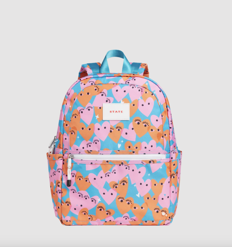 Kane Kids backpack in pink and orange hearts on blue (photo via State)