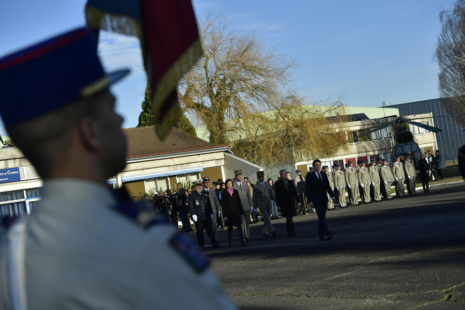 French President Emmanuel Macron arrives for a ceremony in tribute to French soldiers who died in Mali helicopter crash, Monday Jan.13, 2020 in Pau, southwestern France. France is preparing its military to better target Islamic extremists in a West African region that has seen a surge of deadly violence. (AP Photo/Alvaro Barrientos, Pool)