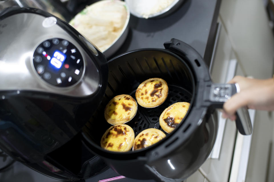 Air fryer machine  in home, Egg Tart ( selective focus )