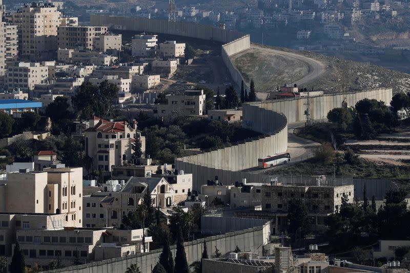 FILE PHOTO: A general view shows the Israeli barrier at the Palestinian town of Abu Dis in the Israeli-occupied West Bank east of Jerusalem