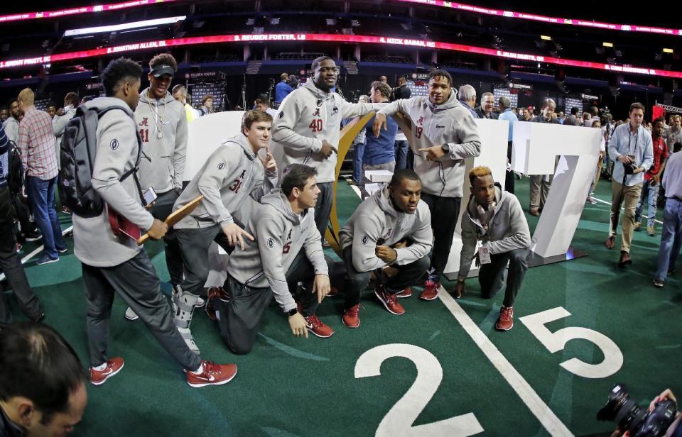 Alabama players pose for a picture during media day for the NCAA college football playoff championship game against Clemson Saturday, Jan. 7, 2017, in Tampa, Fla. (AP Photo/John Bazemore)