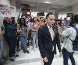 <p>Florida Rep. Carlos Guillermo Smith, leads students as they chant protest slogans outside the House of Representative chamber inside the Florida Capitol in Tallahassee, Fla., Feb 21, 2018. (Photo: Mark Wallheiser/AP) </p>