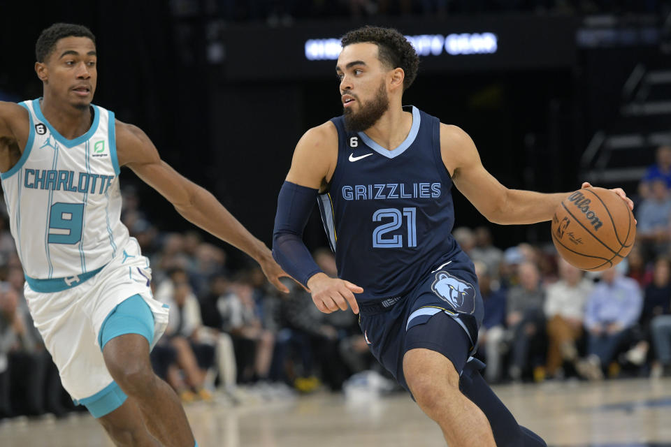 Memphis Grizzlies guard Tyus Jones (21) drives against Charlotte Hornets guard Theo Maledon (9) during the second half of an NBA basketball game Friday, Nov. 4, 2022, in Memphis, Tenn. (AP Photo/Brandon Dill)