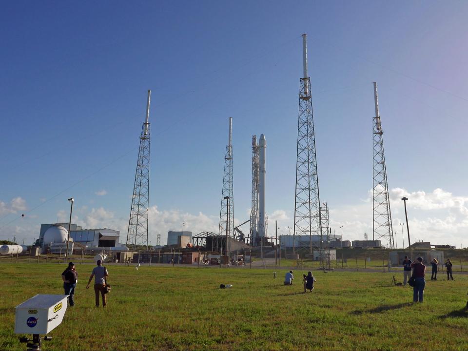 Photographers set up remote cameras preparing to cover the Falcon 9 SpaceX rocket launch at complex 40 at the Cape Canaveral Air Force Station in Cape Canaveral, Fla., Sunday, July 17, 2016. The Falcon 9 scheduled to liftoff early Monday, is headed to the International Space Station with 5,000 pounds of supplies.