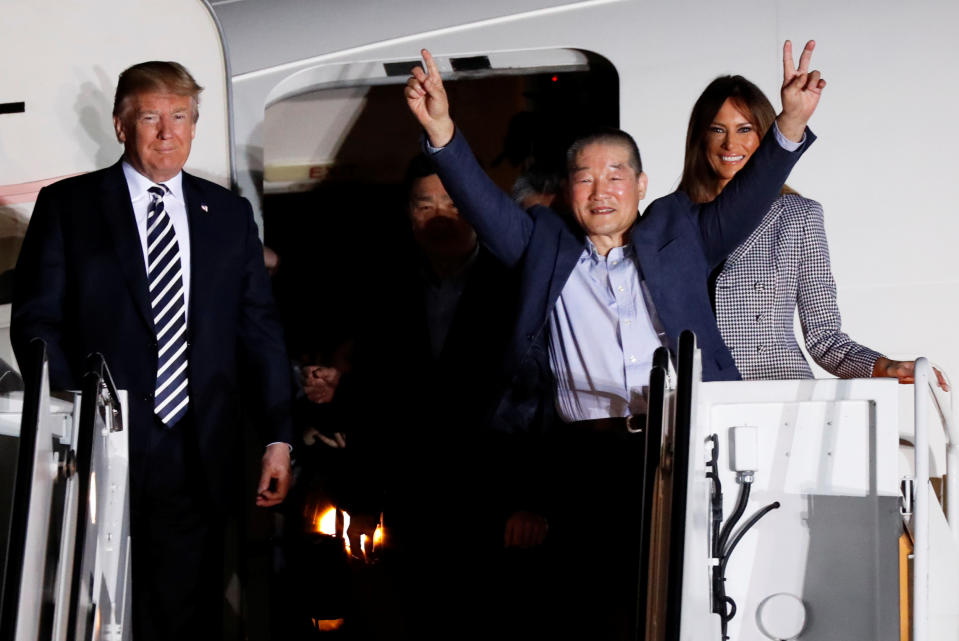 <p>One of the Americans formerly held hostage in North Korea gestures next to President Donald Trump and first lady Melania Trump, upon their arrival at Joint Base Andrews, Md., May 10, 2018. (Photo: Jim Bourg/Reuters) </p>