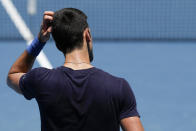 Defending men's champion Serbia's Novak Djokovic practices on Rod Laver Arena ahead of the Australian Open tennis championship in Melbourne, Australia, Wednesday, Jan. 12, 2022. AP Photo/Mark Baker)