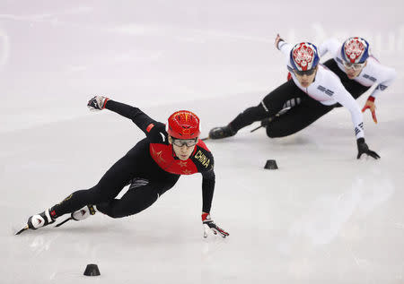 Short Track Speed Skating Events - Pyeongchang 2018 Winter Olympics - Men's 500m Finals - Gangneung Ice Arena - Gangneung, South Korea - February 22, 2018 - Wu Dajing of China in action ahead of Hwang Dae-heon of South Korea and Lim Hyo-jun of South Korea. REUTERS/John Sibley