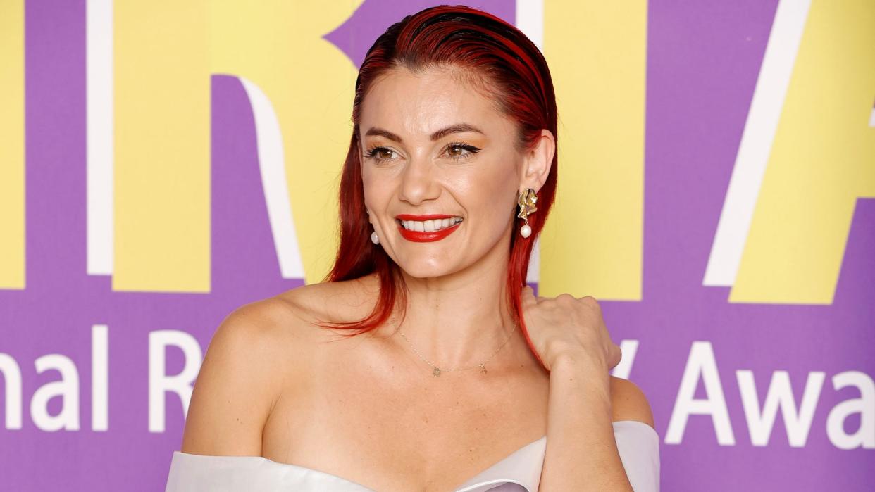 Dianne Buswell in a white dress