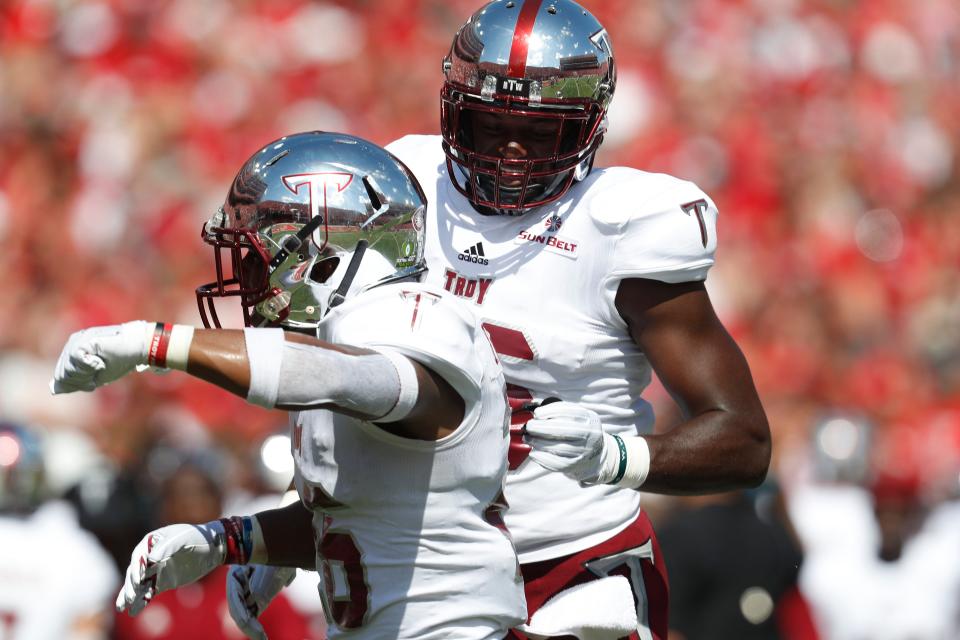 Sep 15, 2018; Lincoln, NE, USA; Troy Trojans running back B.J. Smith (26) celebrates his touchdown with linebacker Walter Pritchett (46) against the Nebraska Cornhuskers in the first half at Memorial Stadium. Mandatory Credit: Bruce Thorson-USA TODAY Sports