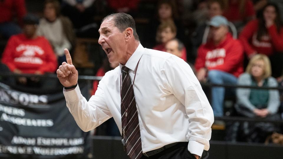 Paulsboro High School's wrestling coach Paul Morina instructs his wrestlers during the meet between Paulsboro and Haddonfield held at Haddonfield Memorial High School on Monday, January 30, 2023.  