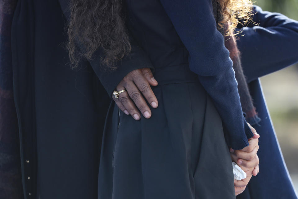 Relatives attend a ceremony for victims Nadine Devillers, Vincent Loques and Brazil's Simone Barreto Silva, in Nice, southern France, Saturday Nov. 7, 2020 after the attack at Notre-Dame de Nice Basilica on October 29, 2020. Three people were killed in an Islamic extremist attack at Notre Dame Basilica in the city of Nice that pushed the country into high security alert. (Valery Hache; Pool via AP)