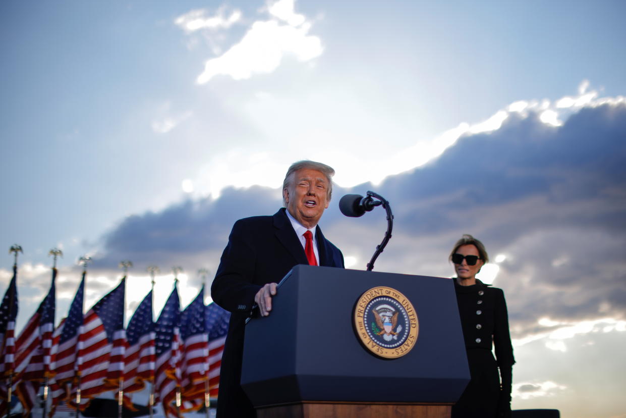 President Donald Trump speaks next to first lady Melania Trump as he departs from the Joint Base Andrews, Maryland on January 20, 2021. (Carlos Barria/Reuters)