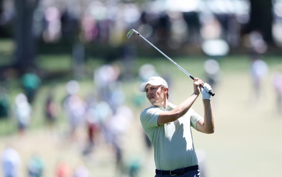 Matt Fitzpatrick hits a shot to the first green