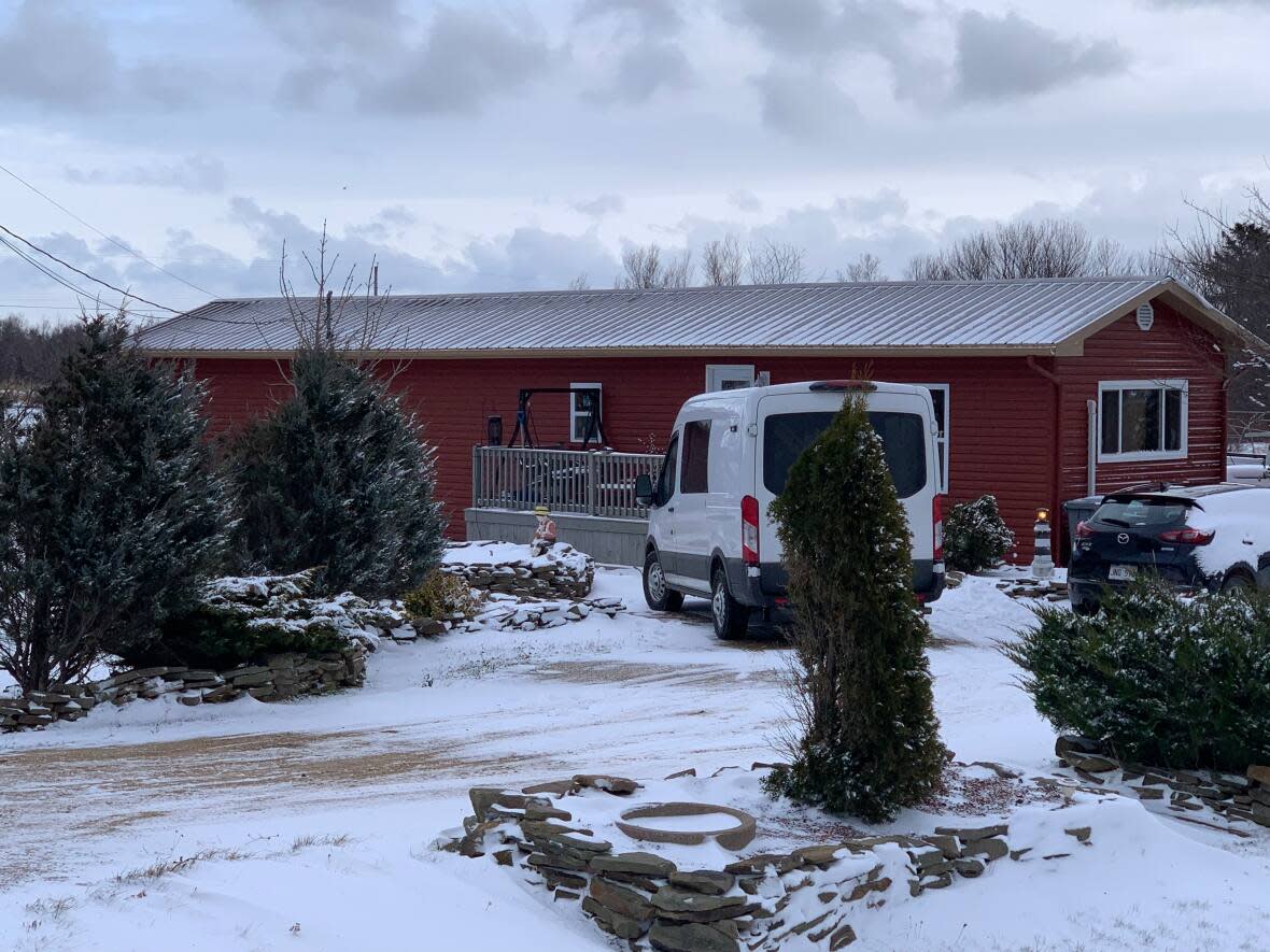 Police investigate a homicide at a residence in the village of Petit-Cap in this December 2021 file photo. (Kate Letterick/CBC - image credit)