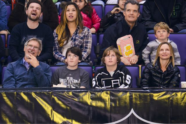 <p>Noel Vasquez/GC Images</p> Harrison Ford, Liam Flockhart and Calista Flockhart attend a hockey game between the Carolina Hurricanes and the Los Angeles Kings at Staples Center on March 1, 2014.