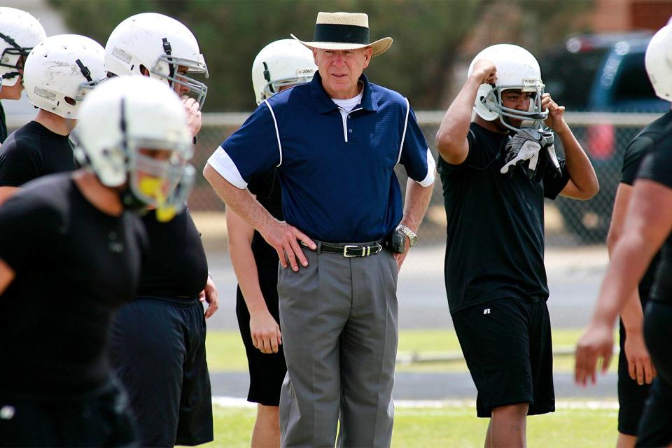 Odessa Permian High School head football coach Gary Gaines watches a his players work out in Odessa, Texas. Gaines was the head coach of the 1988 Permian football team that was the focus of the H.G. Bissinger book "Friday Night Lights: A Town, a Team and a Dream" and the 2004 motion picture "Friday Night Lights."