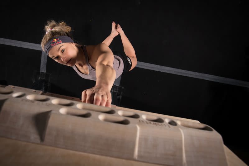 Shauna Coxsey trains on a fingerboard at The Climbing Hangar Matchworks in Liverpool