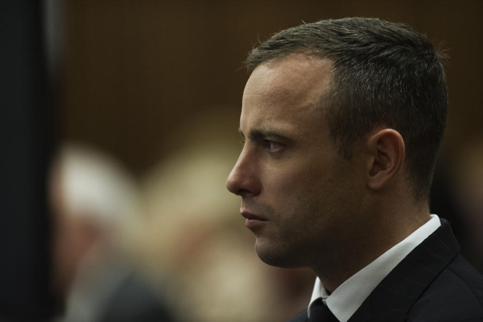 Oscar Pistorius looks straight ahead as he listens to evidence being given in court in Pretoria, South Africa, Wednesday, April 16, 2014. Pistorius is charged with the murder of his girlfriend, Reeva Steenkamp, on Valentines Day in 2013. (AP Photo/Gianluigi Guercia, Pool)