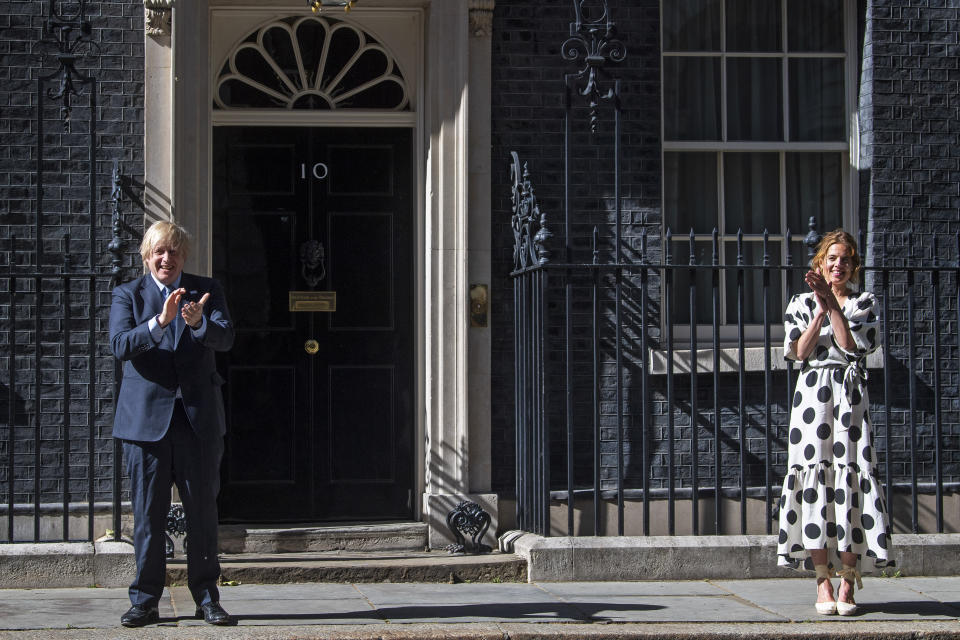 As part of the NHS birthday celebrations, Prime Minister, Boris Johnson and Annemarie Plas, founder of Clap For Our Carers, outside 10 Downing Street, London, join in the pause for applause to salute the NHS 72nd birthday.