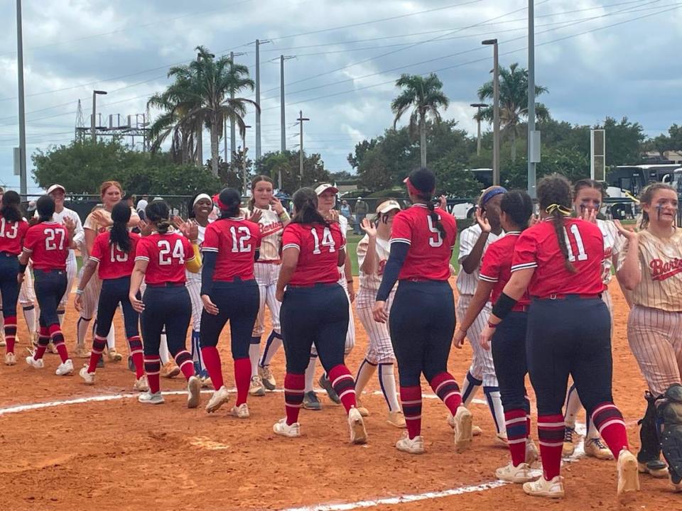 Doral Academy’s softball players shake hands and high-five players from Bartow High after their 3-2 loss on Friday afternoon in a Class 6A state semifinal at Legends Way Ball Fields in Clermont, Fla.