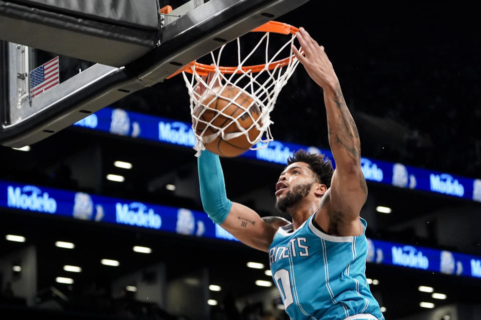 Charlotte Hornets forward Miles Bridges dunks during the first half of an NBA basketball game against the Brooklyn Nets, Sunday, Oct. 24, 2021, in New York. (AP Photo/John Minchillo)