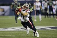 New England Patriots wide receiver Julian Edelman makes a diving catch in front of Seattle Seahawks strong safety Jamal Adams during the second half of an NFL football game, Sunday, Sept. 20, 2020, in Seattle. (AP Photo/John Froschauer)