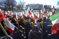 <p>Demonstrators hold Iranian flags during a rally in Lafayette Park across from the White House in Washington, on Saturday, Jan. 6, 2018, in solidarity with anti-government demonstrators in Iran. (Photo: Pablo Martinez Monsivais/AP) </p>