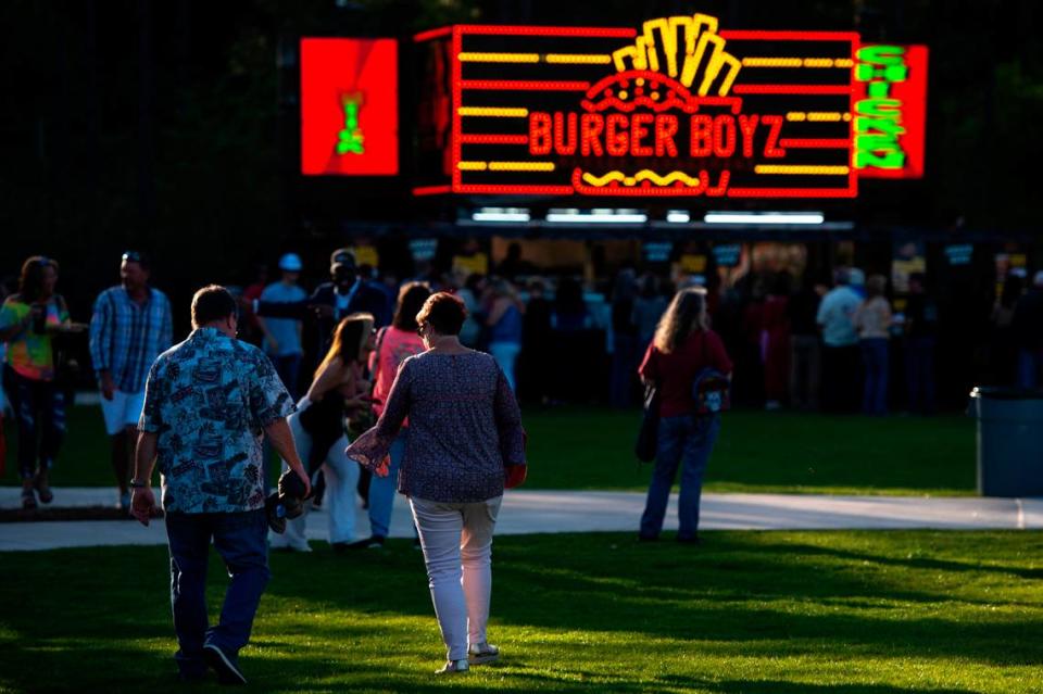 Fans walk to the concession area before the start of the KC and The Sunshine Band concert at The Sound Amphitheater in Gautier on Friday, April 12, 2024. The show marks the multi-million dollar venue’s inaugural show. Hannah Ruhoff/Sun Herald