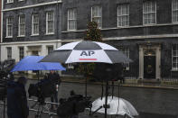 Media outside 10 Downing Street, in London, Sunday, Dec. 13, 2020. Facing yet another self-imposed Brexit deadline on Sunday, the chief negotiators from the European Union and United Kingdom were making last-ditch efforts to scale differences on a trade deal that have proved insurmountable for the best part of the year. (AP Photo/Alberto Pezzali)