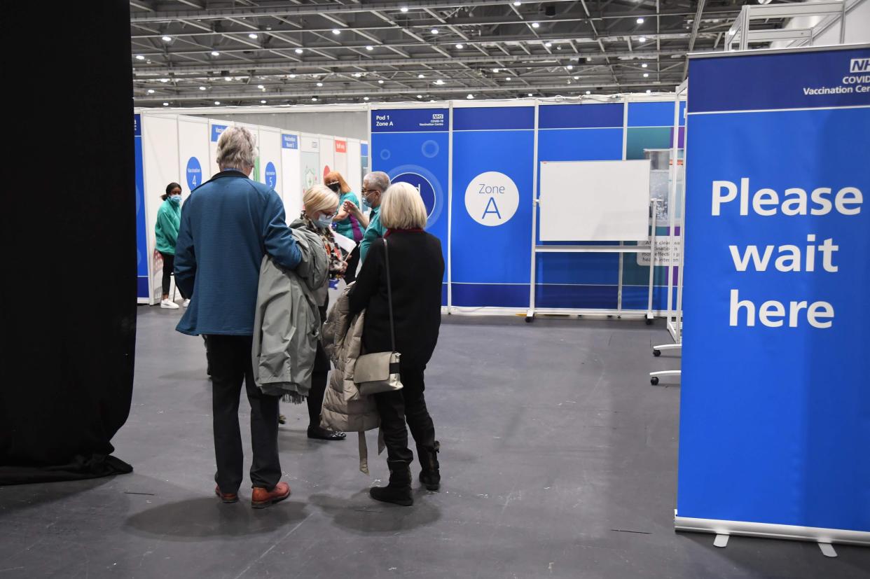 <p>Seven major vaccination hubs opened in England yesterday to help boost the immunisation drive, including one at the ExCel in east London</p> (POOL/AFP via Getty Images)