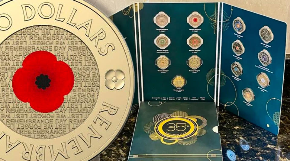 A 14-coin $2 set with a large poppy coin on the left. 