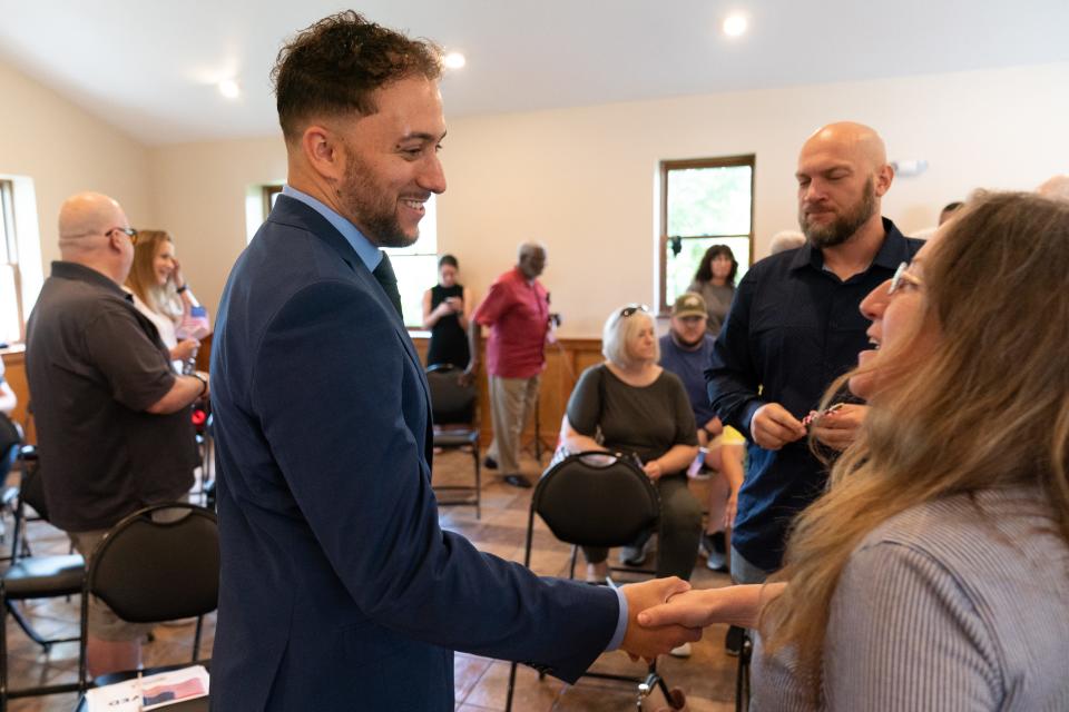 Eli Woody, a Kansas Democrat, shakes hands with supporters gathered at Lake Shawnee Saturday after he announced his candacity for U.S. Congress in the 2nd District seat currently held by Rep. Jake LaTurner, R-Kansas.