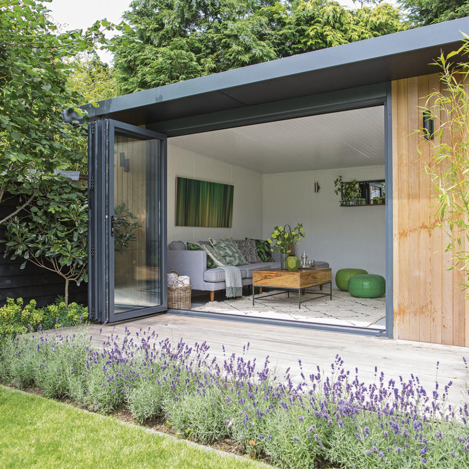 <p> Create a dedicated outdoor area for a garden room by laying a decking area beyond the retracting doors. The frontage provides a space to sit outside, making it an extensive of the extra living space. </p> <p> Frame the compact decking area with simple yet thoughtful planted borders, that separate the decking and the structure from the remaining garden. Don't forget to complete the effect with dramatic garden lighting for the perfect decked garden that will work well into the evening. </p>