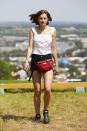 <p><strong>Wearing: </strong>A white vintage-inspired vest, cut-off shorts and Hunter boots and bumbag.</p><p><strong>When</strong>: Glastonbury, June 2019.</p>