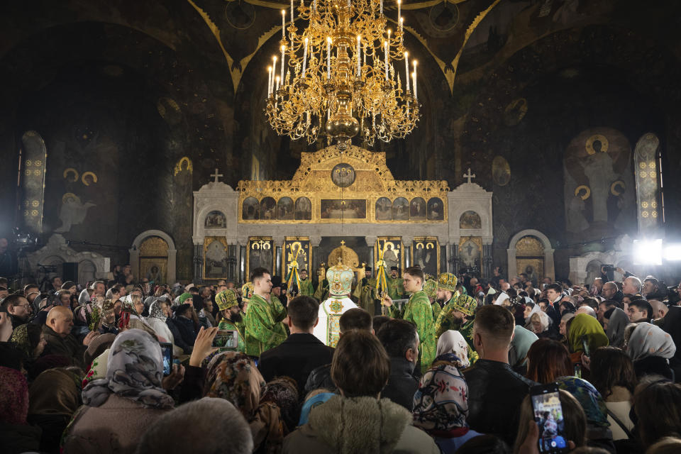 Worshipers and clergy gather to celebrate Palm Sunday at Kiev-Pechersk Lavra monastery, Ukraine's most revered Orthodox site in Kyiv, Ukraine, Sunday, April 9, 2023. (AP Photo/Adam Pemble)