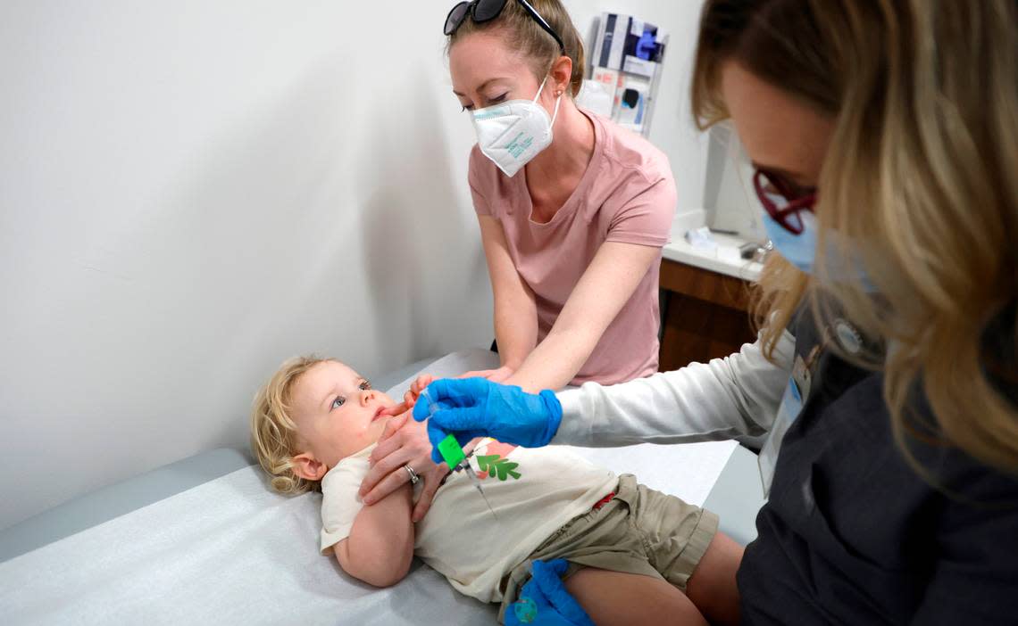 Lynell Batchelor, RN, prepares to give Skylar Boulus, 2, of Cary a Moderna COVID-19 vaccine at UNC Family Medicine & Pediatrics at Panther Creek in Cary, N.C., on Friday, June 24, 2022.