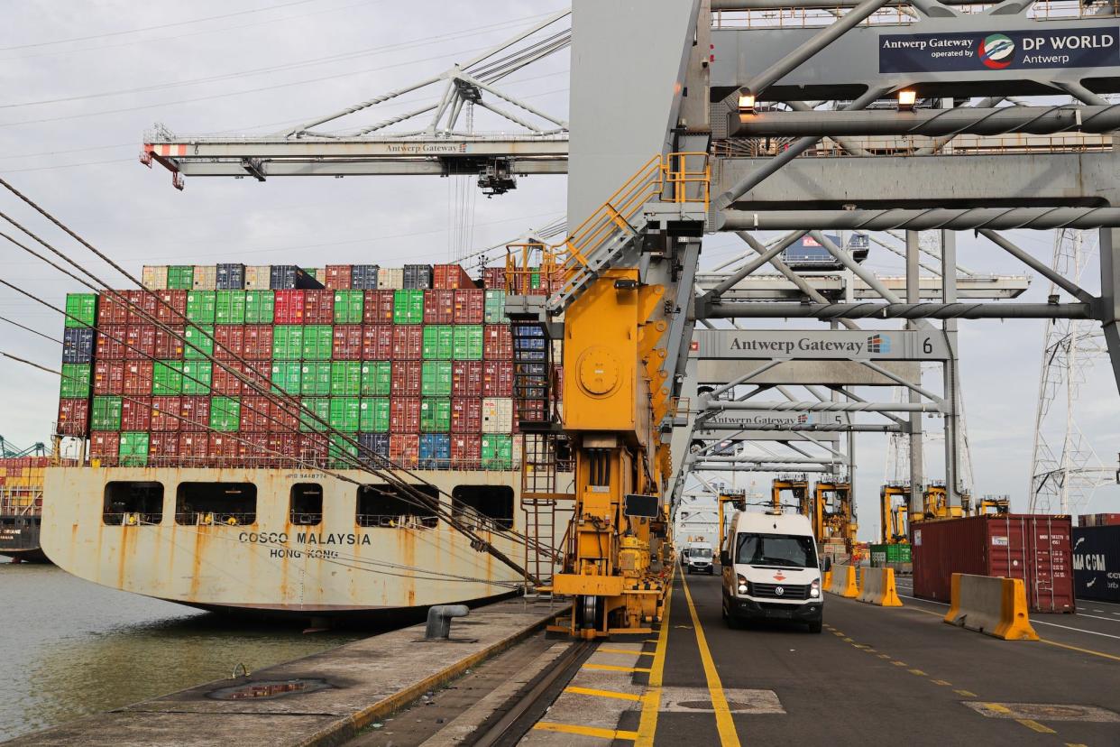 A rear view of a cargo ship stacked with containers alongside a wharf at Port of Antwerp-Bruges in Antwerp, Belgium, Oct. 27, 2022