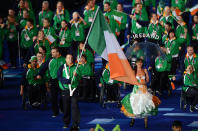 LONDON, ENGLAND - AUGUST 29: Cyclist Cathal Miller of Ireland carries the flag during the Opening Ceremony of the London 2012 Paralympics at the Olympic Stadium on August 29, 2012 in London, England. (Photo by Gareth Copley/Getty Images)